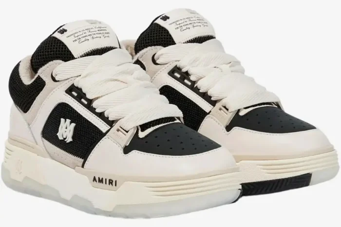 Amiri MA-1 White Black 2024 premium sneakers in a three-quarter front view with wide cream laces. - SKU PF23MFS010-111