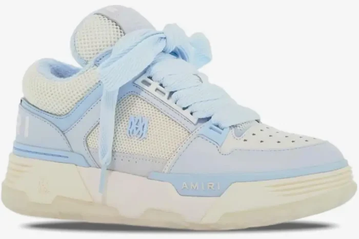 Side profile of an Amiri MA-1 luxury skate sneaker in light blue and white with chunky laces. - SKU MFS001-111