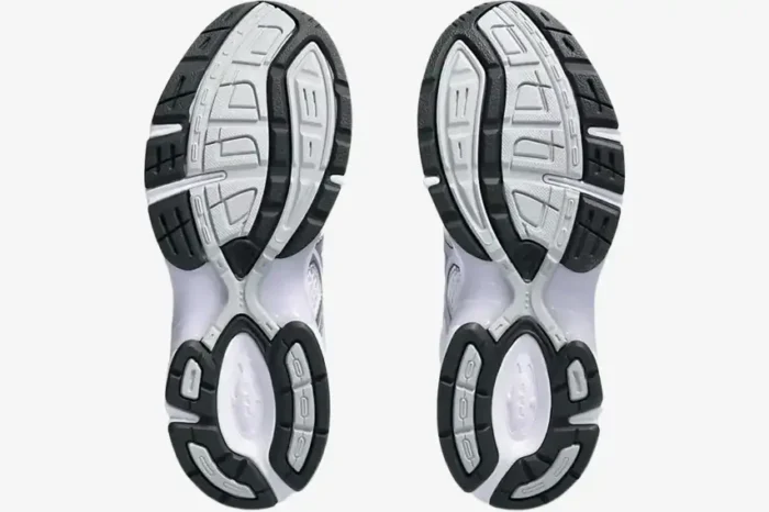 Bottom view of Asics Gel-1130 White Faded Ash Rock sneakers showing the black and white tread pattern. - SKU 1202A164113