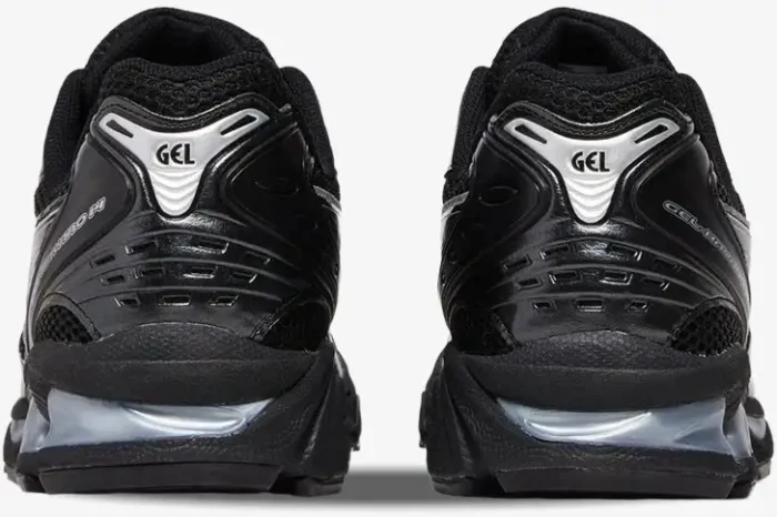 Rear view of Asics Gel-Kayano 14 black and silver metallic sneakers showing heel detail and GEL branding. - SKU 1201A019-006