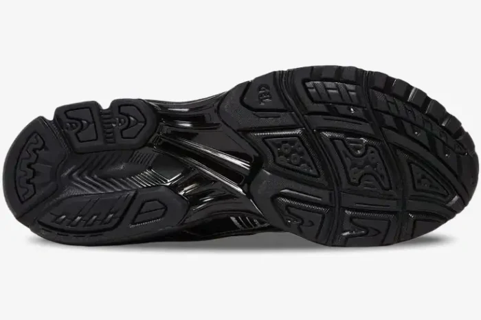 Bottom view of the black rubber outsole on an Asics Gel-Kayano 14 Black Silver Metallic sneaker. - SKU 1201A019-006