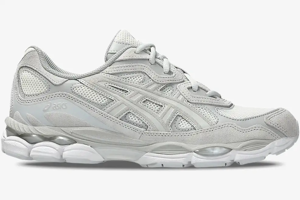 asics-gel-nyc-cream-cloud-grey-side-view-1203a663-101-461-848 Side profile of Asics Gel NYC sneakers in Cream Cloud Grey with mesh and suede overlays. - SKU 1203A663-101