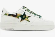 A Bathing Ape Bape Sta Low sneaker in white with green ABC camo star and laces, side profile view. - SKU 1K70191335-GRN