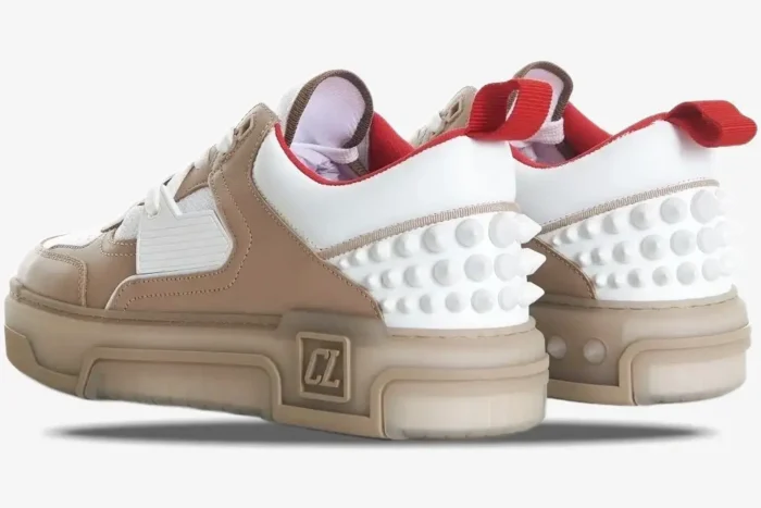 Beige and white Christian Louboutin Astroloubi sneakers featuring white spikes and red pull tabs from a rear angle. - SKU 1240001F688