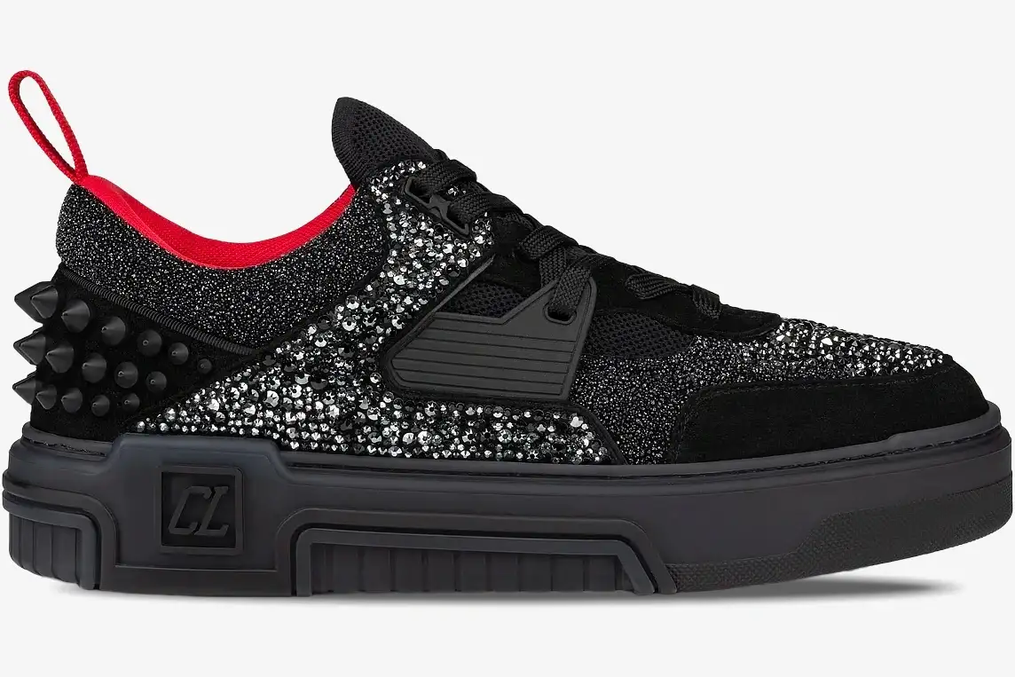 christian-louboutin-astroloubi-black-silver-side-3230886h358-738-345 Side profile of Christian Louboutin Astroloubi sneakers in black and silver with red accents and heel spikes. - SKU 3230886H358