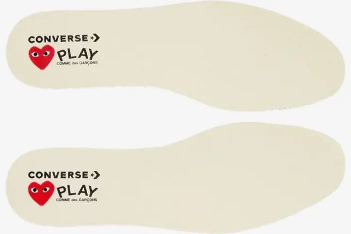 Top-down view of white Converse x Comme des Garçons Play Chuck 70 insoles with red heart logo. - SKU A08805C