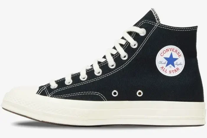 Medial side view of a black Converse Chuck 70 high-top sneaker with white laces and off-white rubber sole. - SKU 150204C