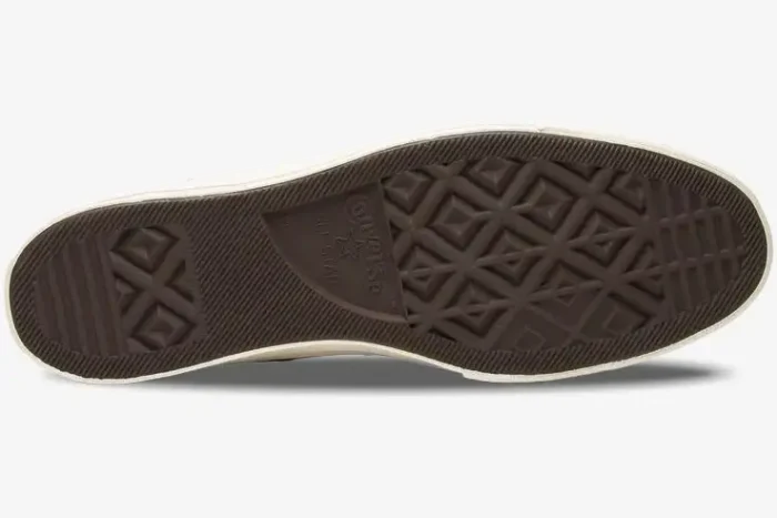 Bottom view of the brown rubber outsole on a Converse Chuck Taylor All Star 70s x CDG Play shoe. - SKU 150206C