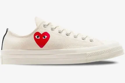 Side view of white Converse Chuck Taylor All Star 70s x Comme des Garçons Play low-top sneakers. - SKU A08805C