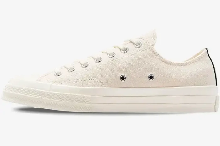 Side profile of a white Converse Chuck Taylor 70s x Comme des Garçons Play low-top sneaker. - SKU A08805C