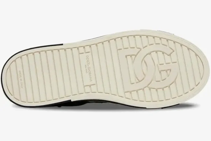 Bottom view of the off-white rubber sole of a Dolce & Gabbana 2.Zero low top sneaker featuring a large DG logo. - SKU CS1863A02238B979