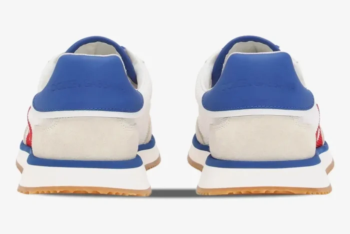 Rear view of Dolce & Gabbana Cushion sneakers in white, blue, and red with orange gum soles. - SKU CS2288A535589926