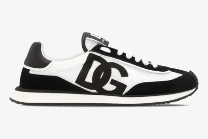 Side profile of a Dolce & Gabbana Cushion sneaker in black and white mesh with a large DG logo. - SKU CK2288A53558I050