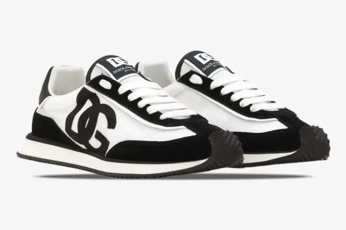 Pair of Dolce & Gabbana Cushion Sneakers in black and white, three-quarter side view. - SKU CK2288A53558I050