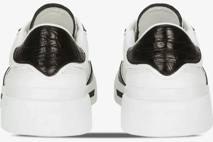 Rear view of white Dolce & Gabbana New Roma sneakers with black croc-embossed heel tabs. - SKU CS2275A2Y8789697