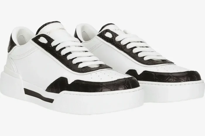 Dolce & Gabbana New Roma sneakers in white calfskin with black croc-embossed trim, three-quarter view. - SKU CS2275A2Y8789697