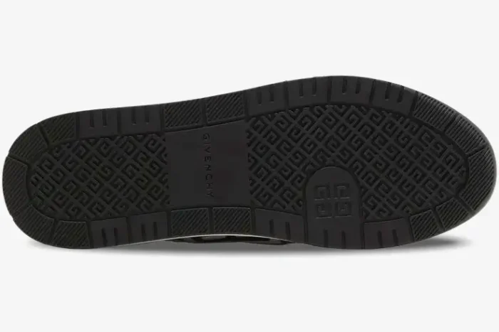Bottom view of the black rubber sole of Givenchy G4 Sneakers featuring a 4G logo pattern. - SKU BH007WH1HJ-004