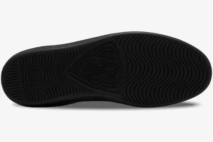 Bottom sole view of black Gucci Ace Bee leather sneakers showing wavy tread and crest logo. - SKU 42944602JP01284