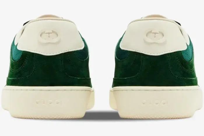 Rear view of Gucci G74 sneakers in green suede with interlocking G logo on white heel tabs and off-white soles. - SKU 791742AADM03143
