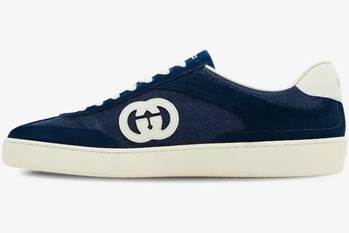 Side view of Gucci G74 sneaker in blue suede and mesh with interlocking G logo and cream sole. - SKU 791742AADM04141