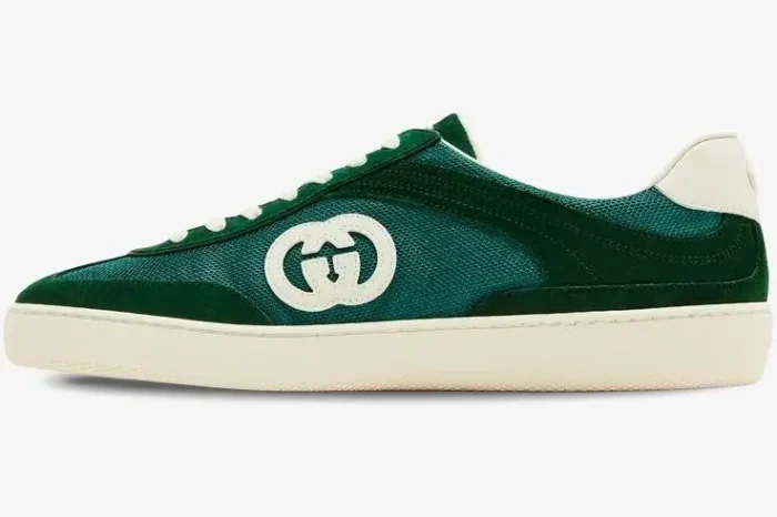 Side profile of a Gucci G74 Interlocking G sneaker in green suede and mesh with an off-white sole. - SKU 791742AADM03143