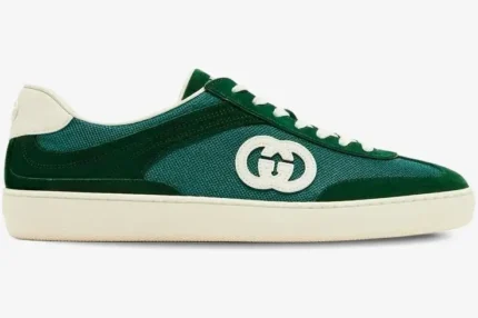 Side profile of a Gucci G74 Interlocking G sneaker in green suede and mesh with white sole. - SKU 791742AADM03143