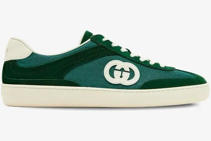 gucci-g74-interlocking-g-green-suede-side-view-791742aadm03143-805-613 Side profile of a Gucci G74 Interlocking G sneaker in green suede and mesh with white sole. - SKU 791742AADM03143