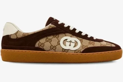 Side profile of a Gucci G75 sneaker in dark brown suede and GG Supreme canvas with a gum sole. - SKU 791742AAEGA2242