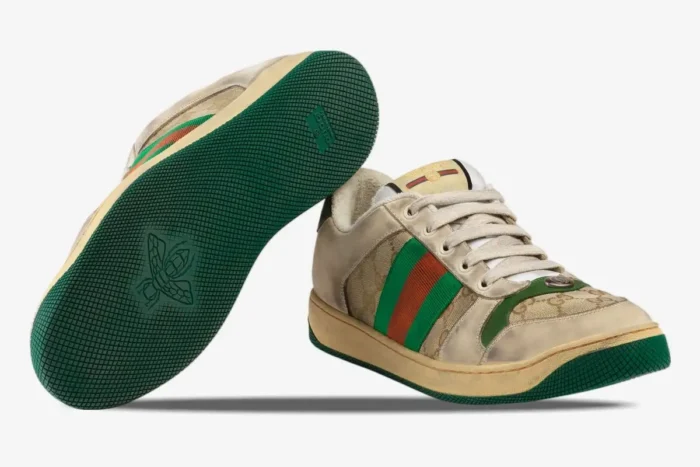 Gucci GG Screener Distressed 'GG Canvas' sneakers in beige and green, showing side and sole view. - SKU 5465519Y9209666