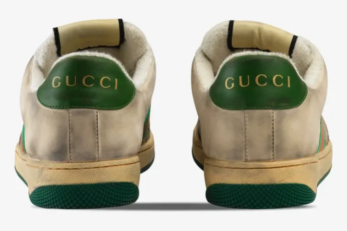 Rear view of Gucci GG Screener Distressed sneakers in off-white with green heel tabs. - SKU 5465519Y9209666