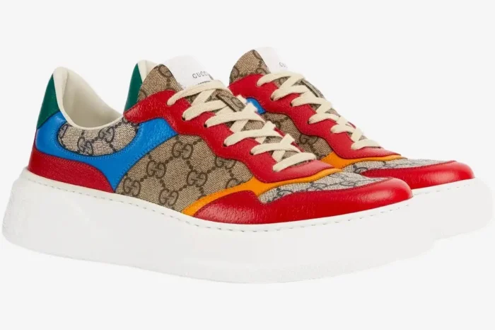 Gucci GG Supreme low top sneakers in beige, blue, and red, side view on a white background. - SKU 726828FABAV4050