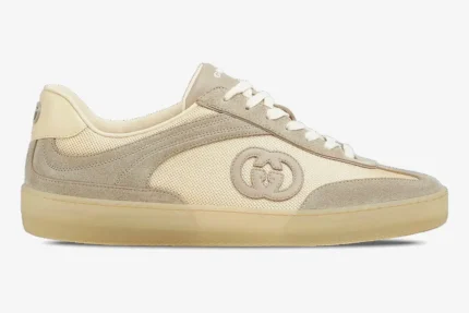 Side view of Gucci Interlocking G sneaker in oatmeal suede and mesh with a translucent gum sole. - SKU 791742AAECN9548