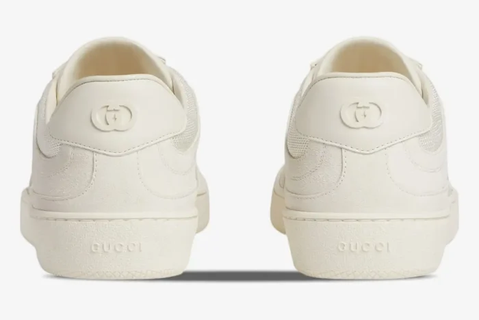 Rear view of Gucci Interlocking G Sneakers in off-white leather showing the heel logo and textured sole. - SKU 791742AADM09110