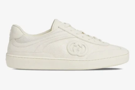 Off-white Gucci Interlocking G sneaker featuring a mesh upper and side logo, side view. - SKU 791742AADM09110