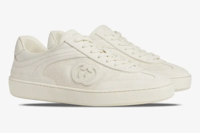 Off-white Gucci Interlocking G Sneakers shown from a side profile angle with mesh detailing. - SKU 791742AADM09110