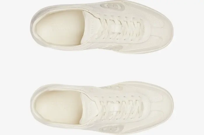 Top-down view of off-white Gucci Interlocking G sneakers with mesh panels and tonal laces. - SKU 791742AADM09110
