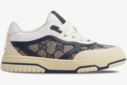 Side profile of a Gucci Re-Web Sneaker in beige ivory blue GG canvas with a chunky cream sole. - SKU 787476-AADHW-9552