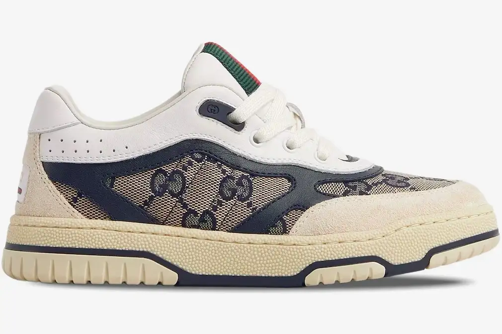 gucci-re-web-sneaker-beige-ivory-blue-side-view-787476-aadhw-9552-244-861 Side profile of a Gucci Re-Web Sneaker in beige ivory blue GG canvas with a chunky cream sole. - SKU 787476-AADHW-9552