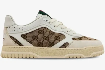 Side profile of a Gucci Re-Web sneaker featuring white leather, beige suede, and GG monogram canvas. - SKU 787476-AADHW-9573