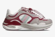 Side profile of a Gucci Run 2.0 sneaker in Rosso Ancora and grey mesh with signature stripes. - SKU 814040FAD5T8754