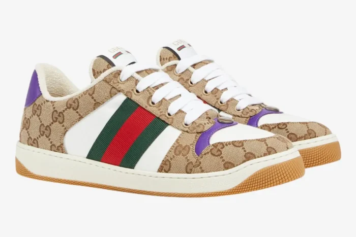 Gucci Screener sneakers in beige GG canvas with white leather and purple accents, three-quarter view. - SKU 812638FAD3U9752