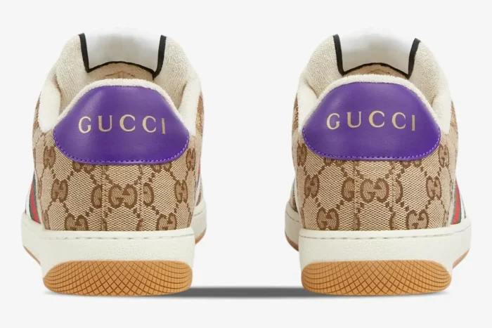 Rear view of Gucci Screener sneakers in beige and white with purple heel tabs and gold logo. - SKU 812638FAD3U9752