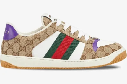 Side view of Gucci Screener sneakers in beige GG canvas with white leather, purple accents, and green-red web stripe. - SKU 812638FAD3U9752