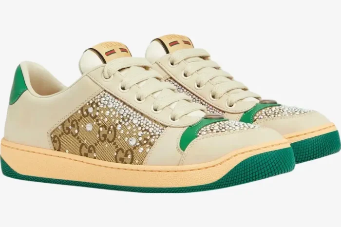 Side view of Gucci Screener Low Top sneakers in ivory and green with GG crystal canvas details. - SKU 812041AAEB29541
