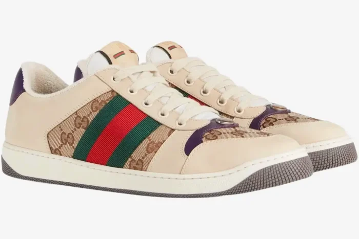 Gucci Screener GG Supreme sneakers in beige with purple heel and green-red web, three-quarter view. - SKU 546551HVKI09765