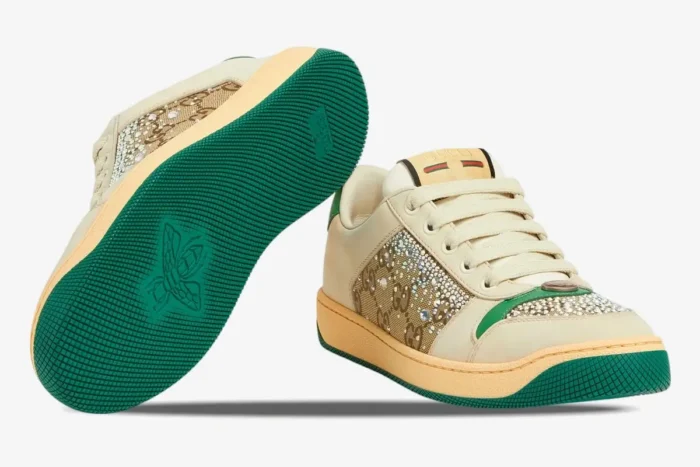 Gucci Screener Low Top sneakers in ivory and green, showing crystal GG canvas and a green sole with bee detail. - SKU 812041AAEB29541