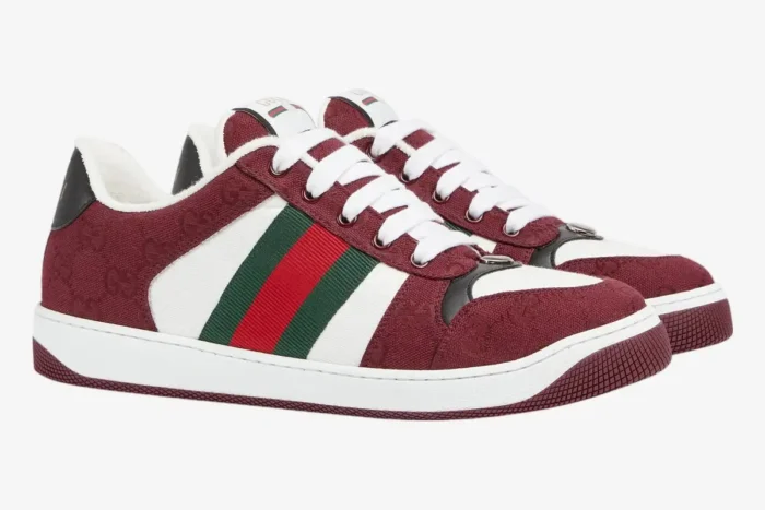 Gucci Screener Rosso Ancora GG canvas sneakers in deep red and white, three-quarter side view. - SKU 812638FAD7W8542