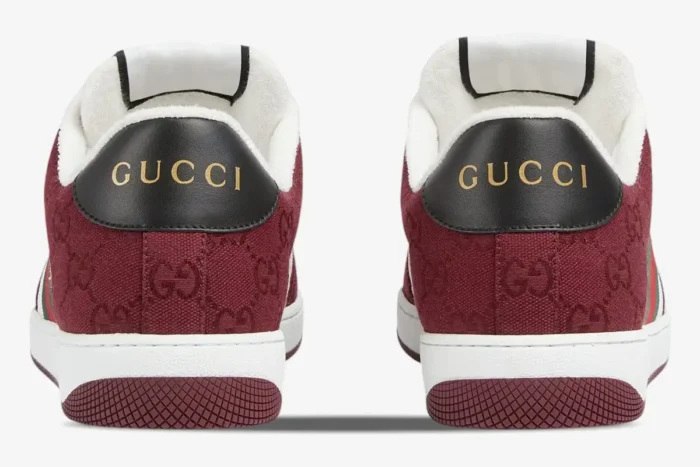Rear view of Gucci Screener Rosso Ancora GG Canvas sneakers with gold logo on black heel tabs. - SKU 812638FAD7W8542