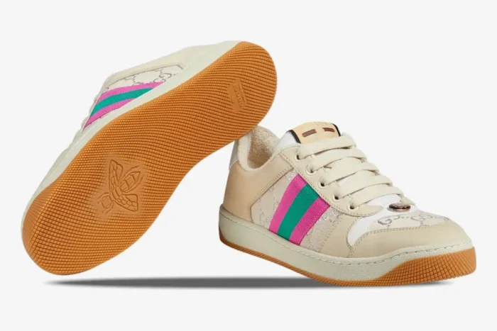 Gucci Screener women's sneakers in white GG lamé with pink and green web, showing side profile and bee-patterned sole. - SKU 5776842C8309150