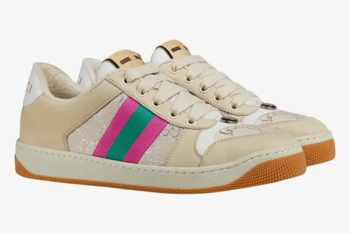 Side view of Gucci Screener women's sneakers in white GG lamé with pink and green web stripes. - SKU 5776842C8309150